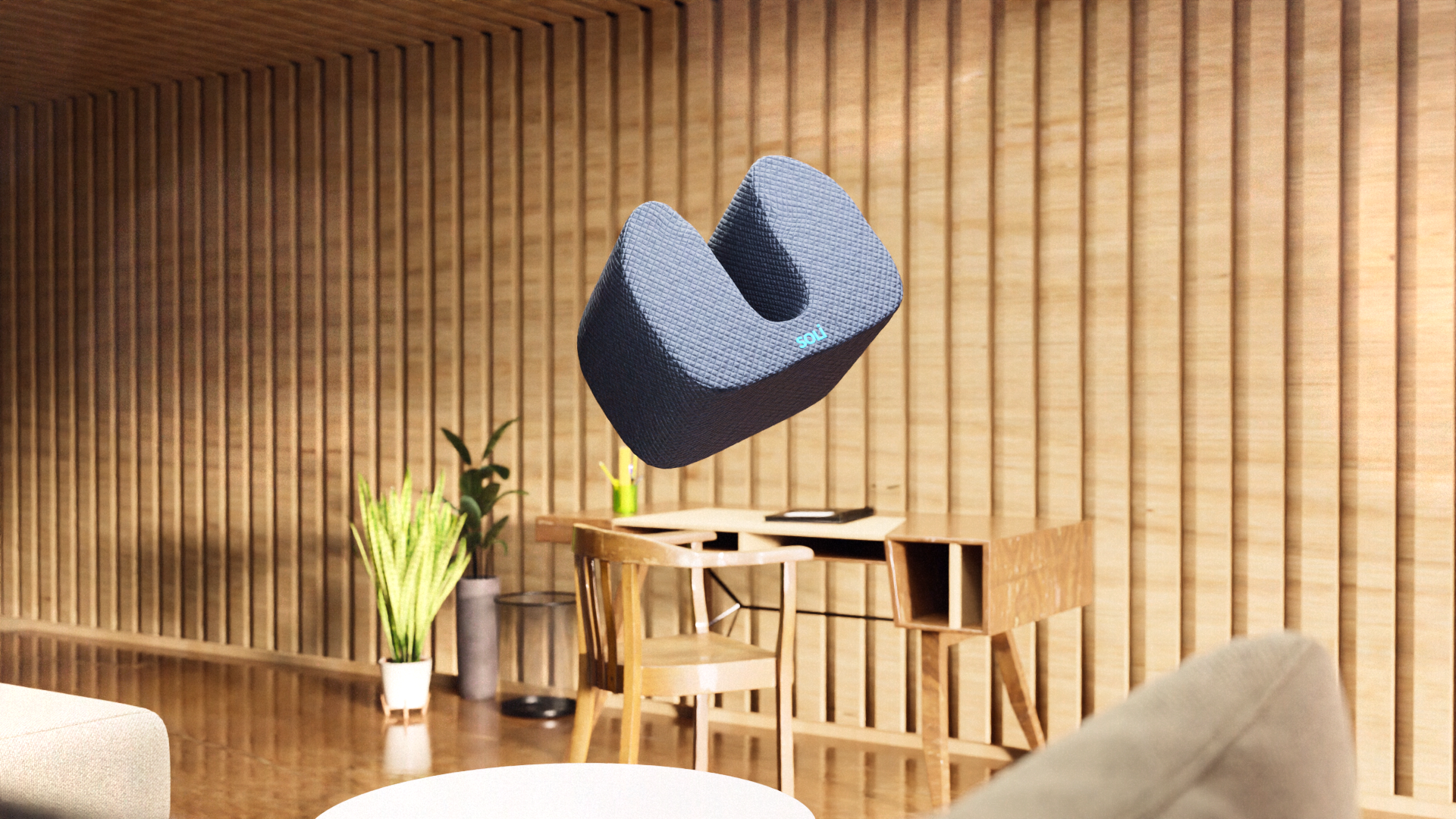 a pillow with speakers is shown in a home environment.